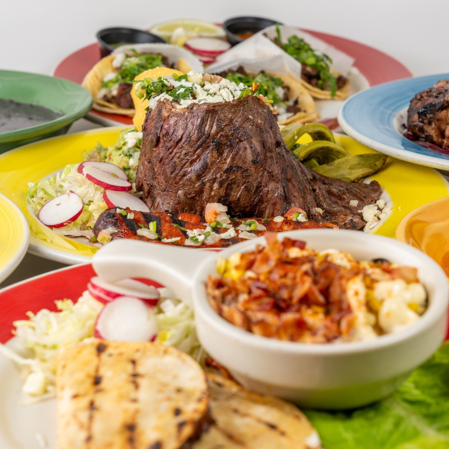 A spread of Gaby’s Cafe dishes including tacos and grilled steak