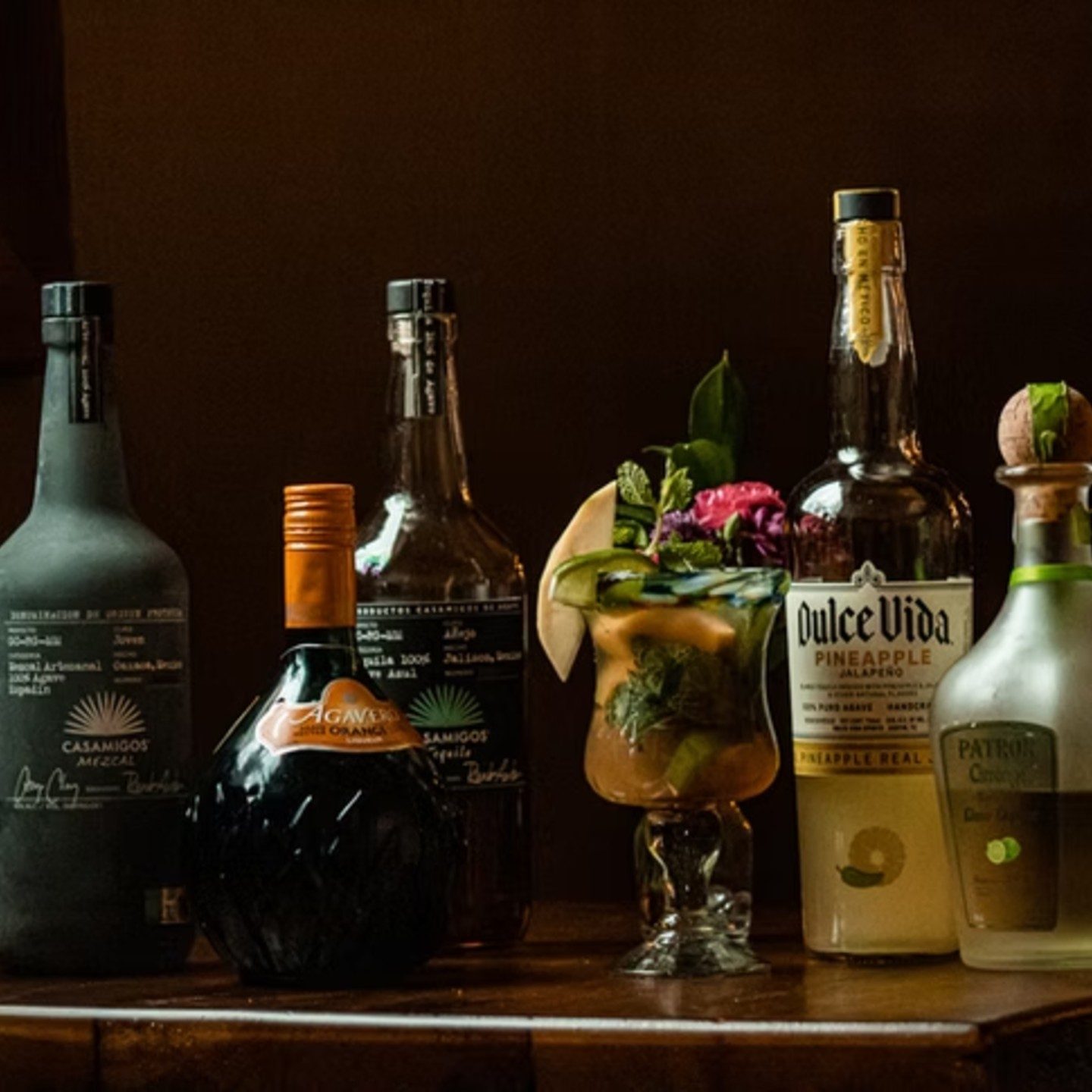 Tequila bottles and a cocktail on the Gaby's Cafe bar